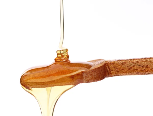 Tropfender Honig auf Löffel — Stockfoto