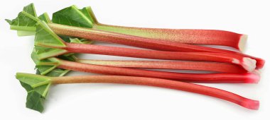 Fresh rhubarb stem and leaves over white background