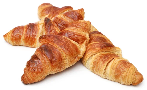 Närbild Välsmakande Croissant Över Vit Bakgrund — Stockfoto