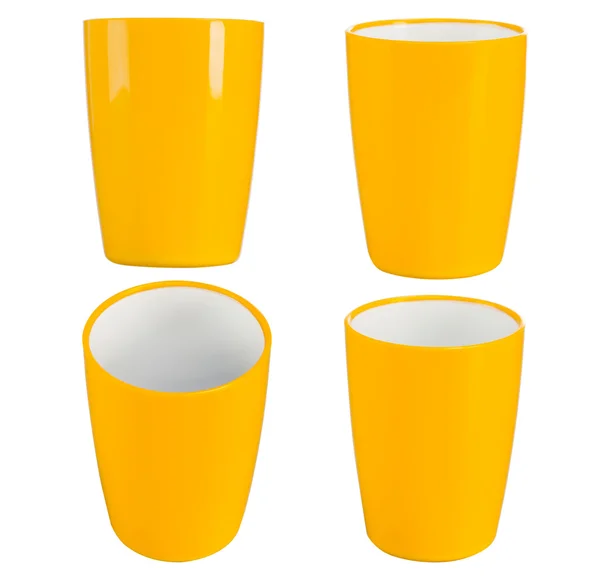 Yellow plastic glass for juice — Stock Photo, Image