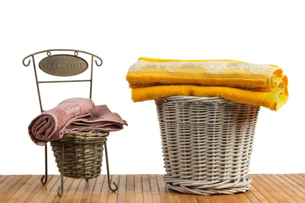 Wicker baskets full of clean colored towels — Stock Photo, Image