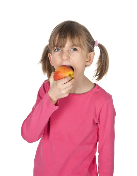 Young girl biting into an apple — Stock Photo, Image