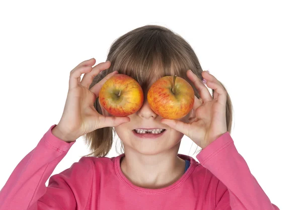 Girl covers her eyes with apples — Stock Photo, Image