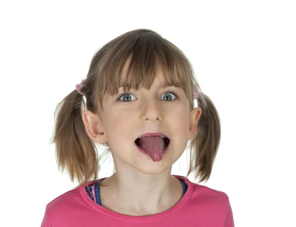 Girl puts out her tongue — Stock Photo, Image