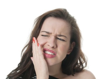 Woman with toothache holding her cheek clipart