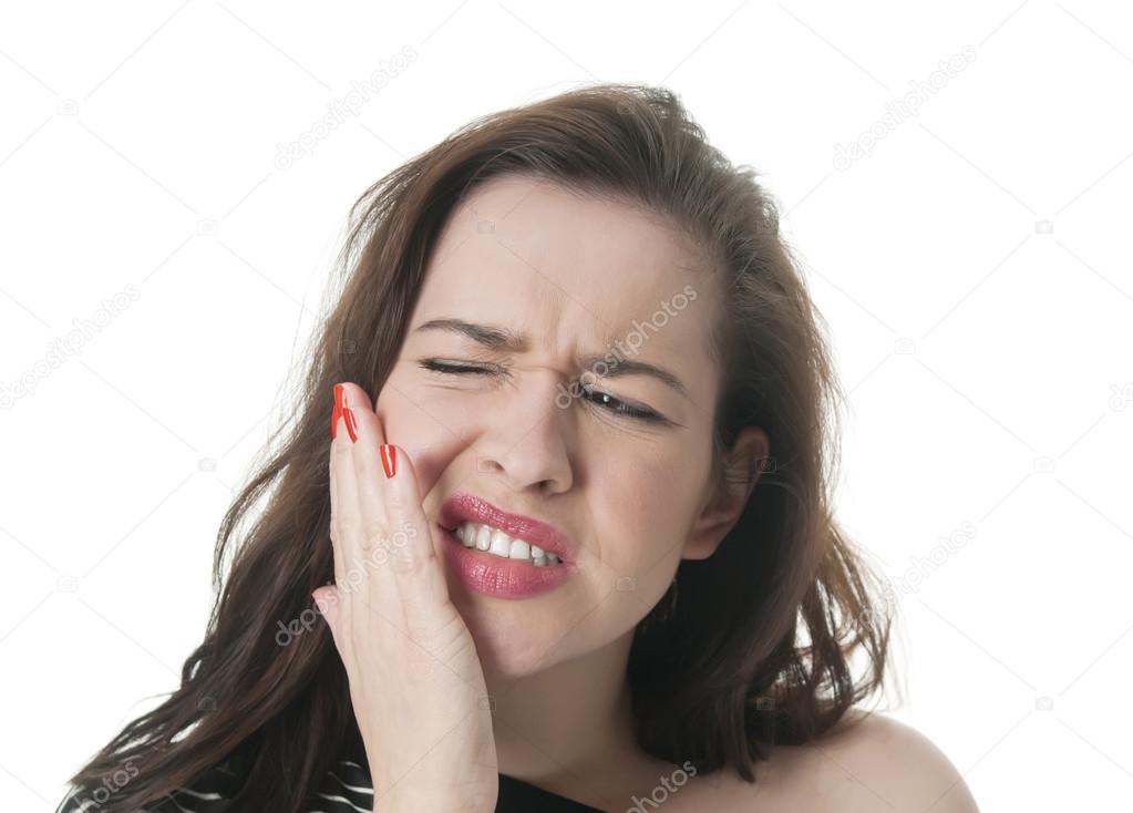 Woman with toothache holding her cheek