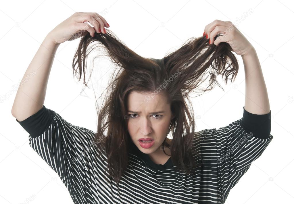 Woman tearing her hair out