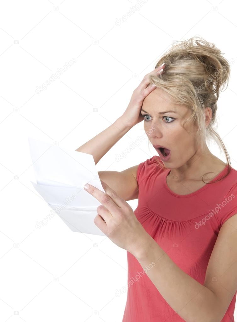 Shocked woman reading bad news