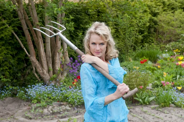 Woman with pitchfork — Stock Photo, Image