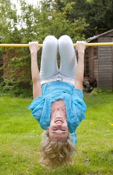 Woman on the high bar — Stock Photo, Image