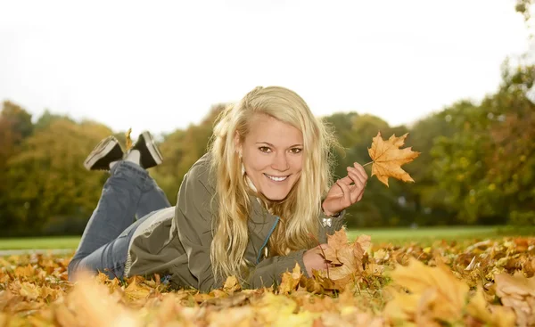 Teenager with autumn leave Stock Photo