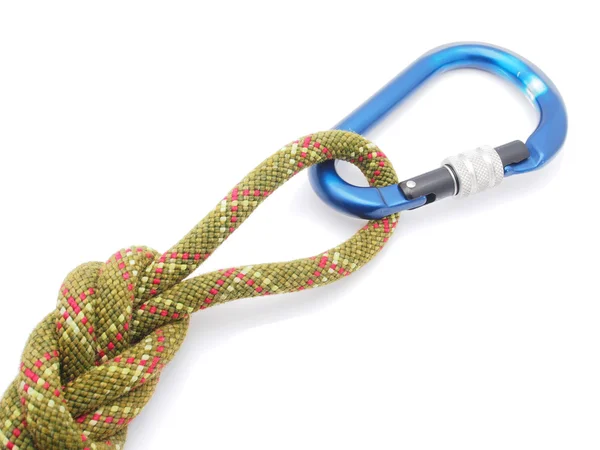 Klimtouw en een carabiner op een witte achtergrond — Stockfoto