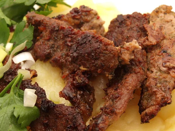 Meat with a potato on a plate — Stock Photo, Image