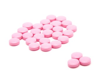 beyaz zemin üzerinde pembe tabletleri