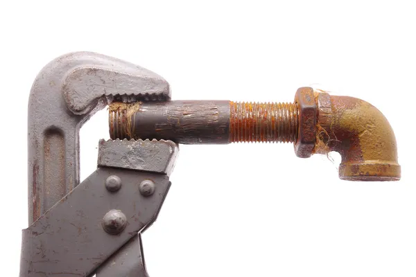 Old a pipe and a wrench on a white background — Stock Photo, Image