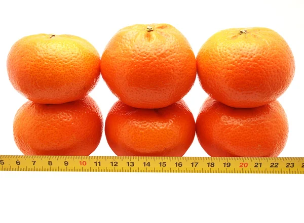 Tangerines and tape on a white background — Stock Photo, Image