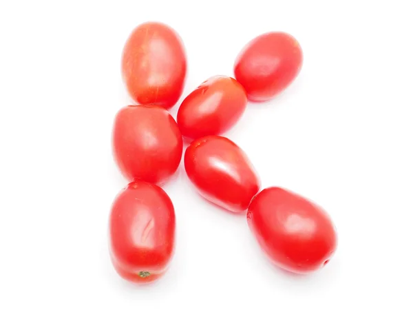 Beyaz zemin üzerine domates mektup — Stok fotoğraf