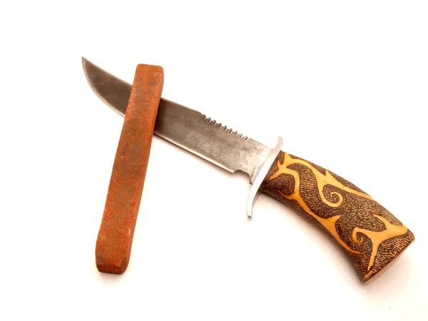 Cuchillo y piedra de molienda — Foto de Stock