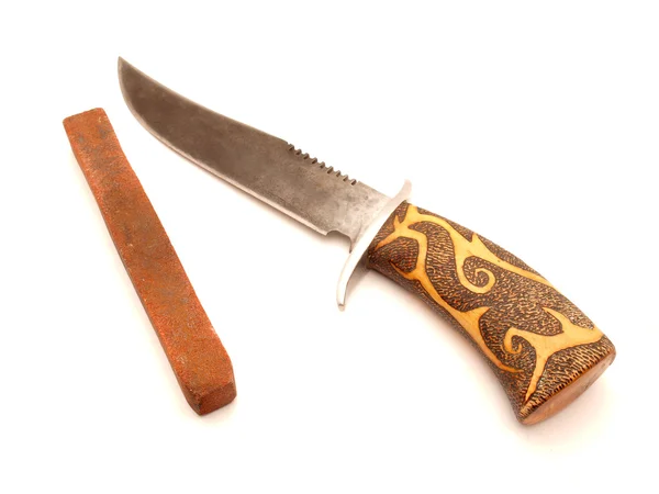 Cuchillo y piedra de molienda — Foto de Stock