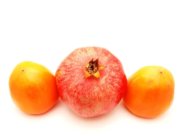 Pomegranate and a persimmon — Stock Photo, Image