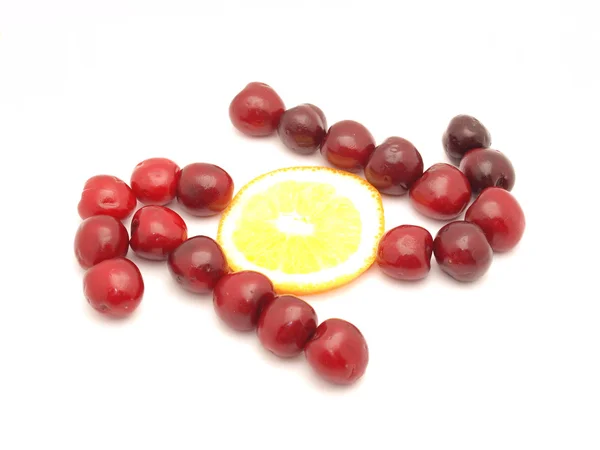 Two arrows from a cherry and an orange — Stock Photo, Image