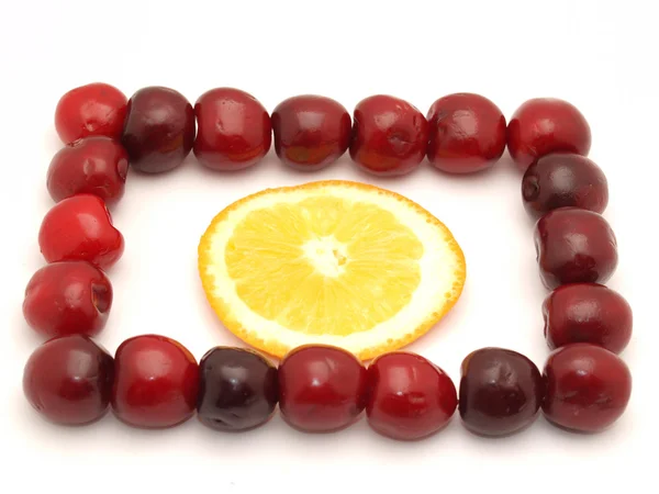 Framework from a cherry and an orange — Stock Photo, Image