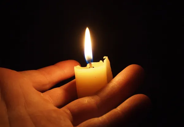 Hand with candle Stock Image