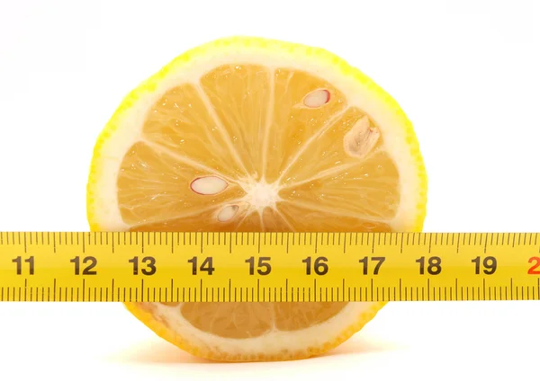 Lemon and ruler — Stock Photo, Image