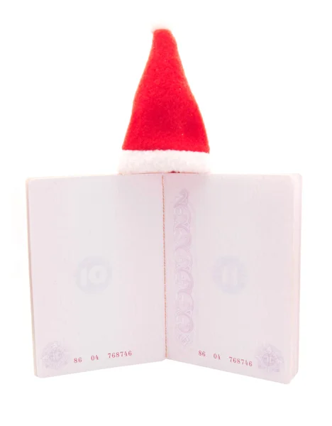 Neue Mütze und Reisepass auf weißem Hintergrund — Stockfoto