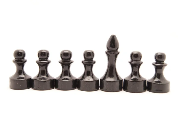 Černé šachy na bílém pozadí — Stock fotografie