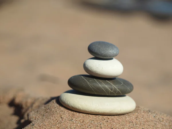 Pebbles in the sand — Stock Photo, Image