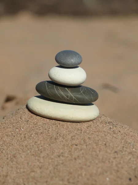 Pebbles in the sand — Stock Photo, Image