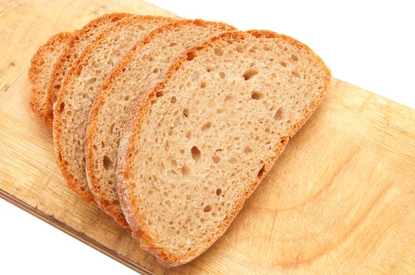 Brot und Küchentafel auf weißem Hintergrund — Stockfoto