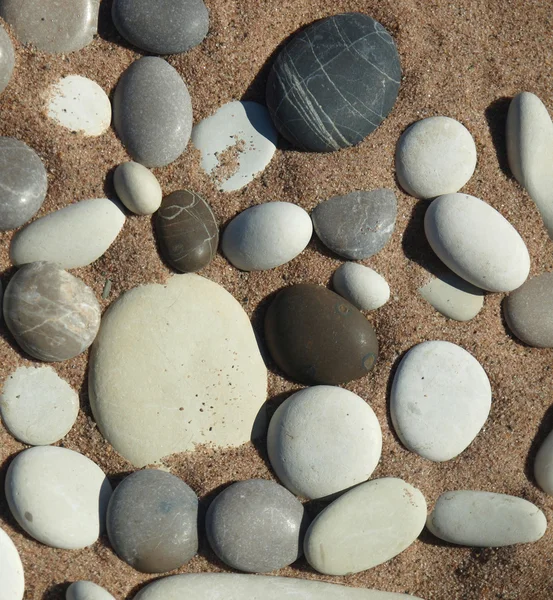 Pebbles in the sand — Stock Photo, Image