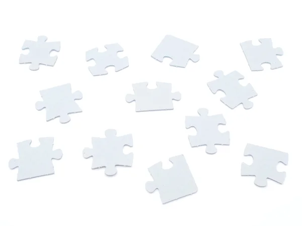 Puzzle sobre um fundo branco — Fotografia de Stock