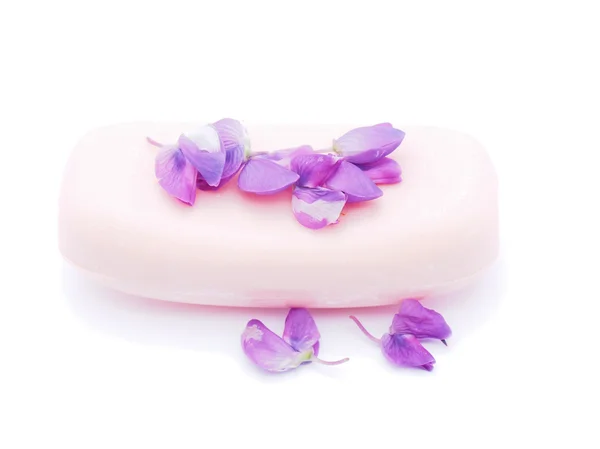 Soap and flowers on white background — Stock Photo, Image