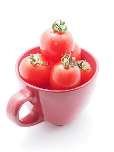 Tomatoes in a bowl on a white background — Stock Photo, Image