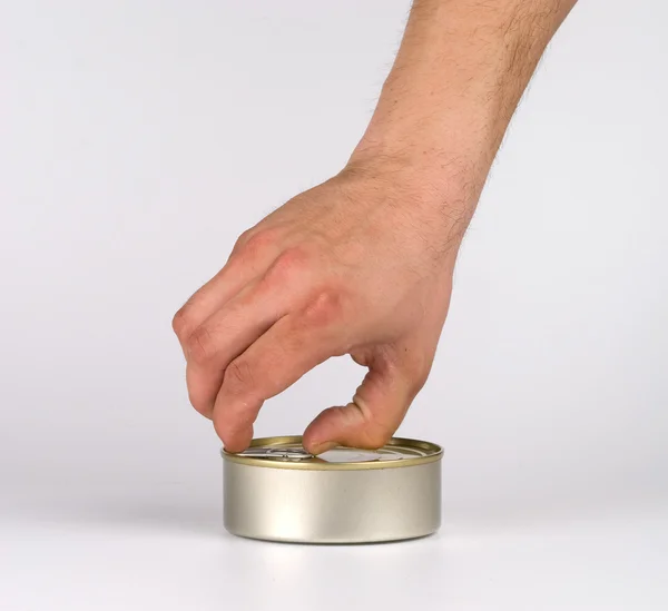 Hand opening tin can. — Stock Photo, Image