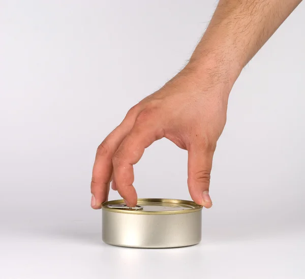 Hand opening tin can. — Stock Photo, Image