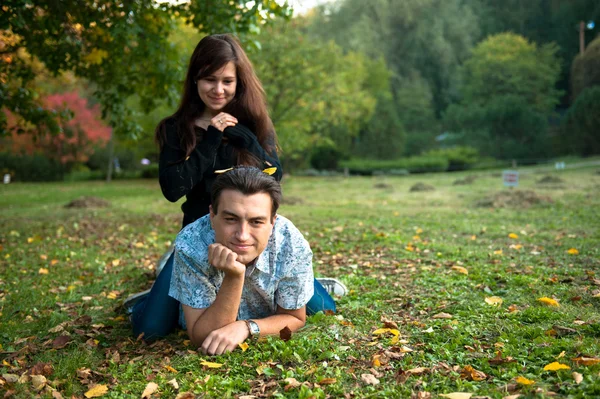 Loving couple lying on the grass Stock Image