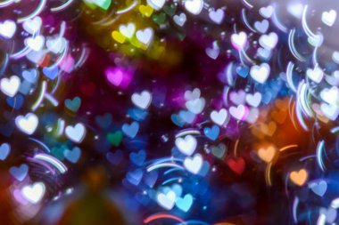 Noel ve yeni yıl arkaplanı parlak renkli ve çok renkli dekorasyon ve tasarım için güzel kıvrımlı bokeh 