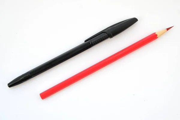 Black Pen Red Pencil White Background — Photo