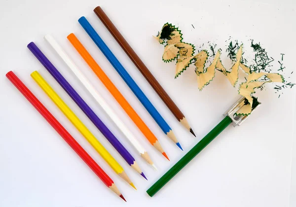 multicolored pencils for drawing and art on a white background
