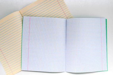 striped and plaid notebook close-up on a white background