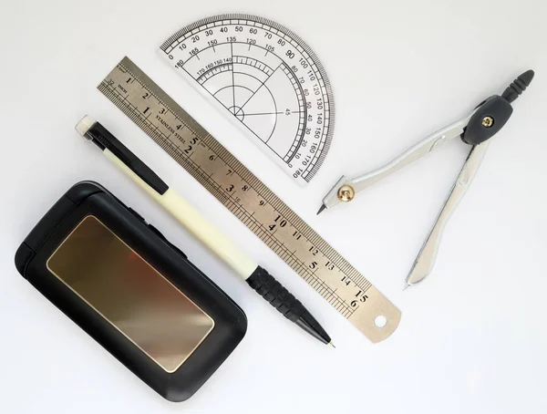 School Supplies Pencils Ruler Compasses Protractor Phone White Background — Stock fotografie