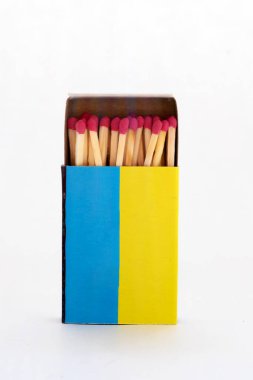 box of matches in yellow-blue colors close-up on a white background