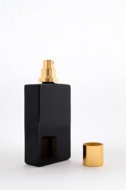 black perfume and eau de toilette bottle with golden cap