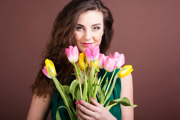 Beautiful girl with tulips — Stock Photo, Image