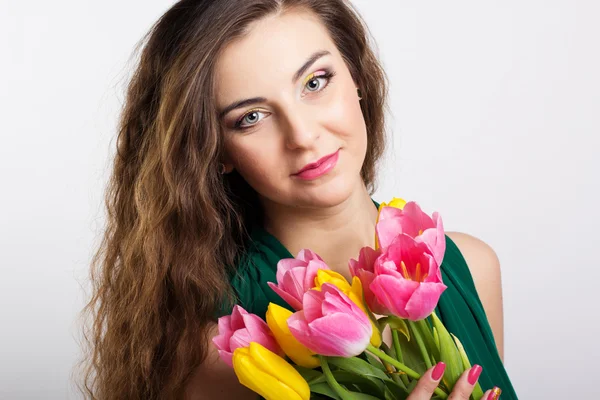 Beautiful girl with tulips — Stock Photo, Image