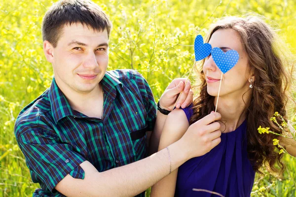 Happy couple with two blue hearts — Stock Photo, Image